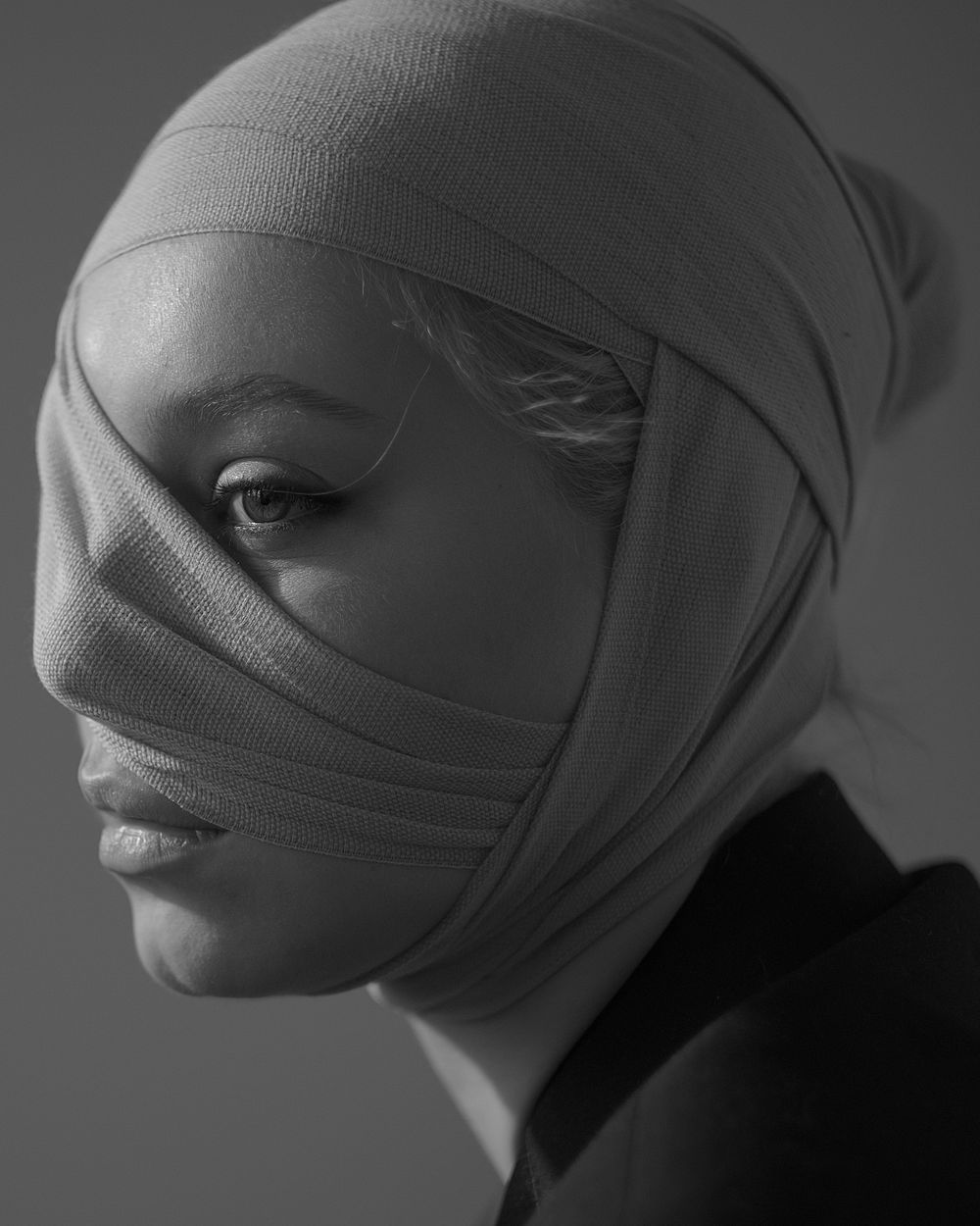 Simonetta Gibejova, her head wrapped in bandages, looking towards the camera